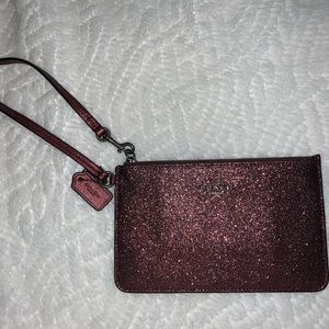 Pink sparkly wristlet from Coach brand nvr used